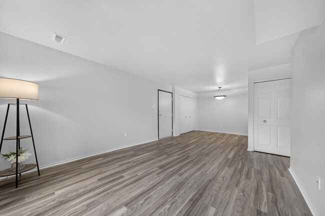 Spacious living and dining room at Woodland Villa Apartments in Westland, MI. - Woodland Villa Apartments