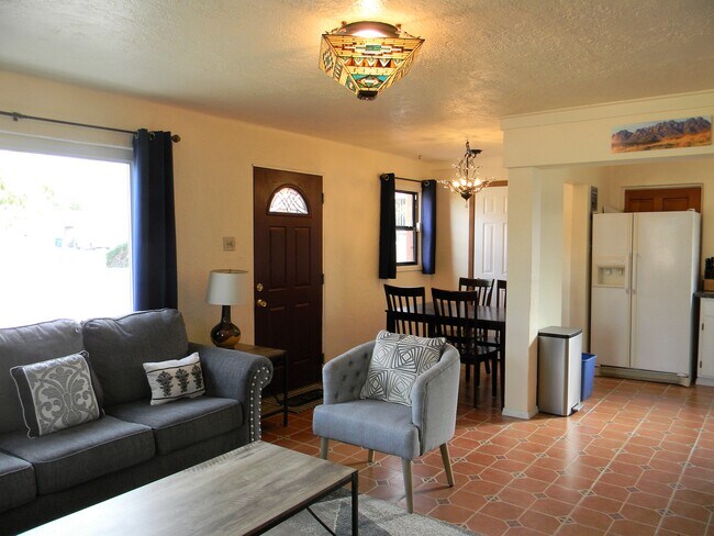 Living room with dining room and kitchen in background - 1043 Girard Blvd NE