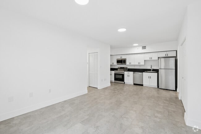 4BR, 2BA - 1,220SF - Living Room & Kitchen - 147 NW 59th St