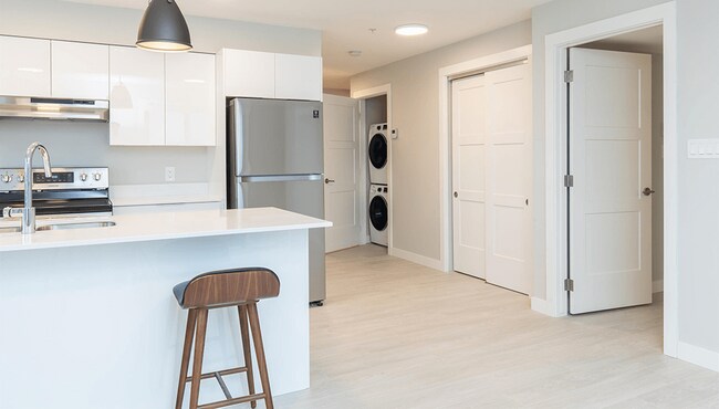Crown Isle Boulevard Kitchen & Living Space WIth Insuite Laundry - Crown Isle Boulevard