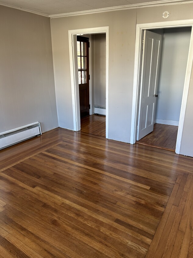 Living room looking towards from door on left and stairs to bedrooms on right - 36 Niles Rd (Windsor, CT)