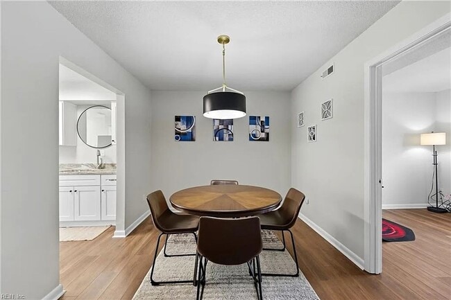 Photo - Updated 3BR Townhome — Assigned Parking, HOA Included, Military Welcome. Move in by March 31st an...