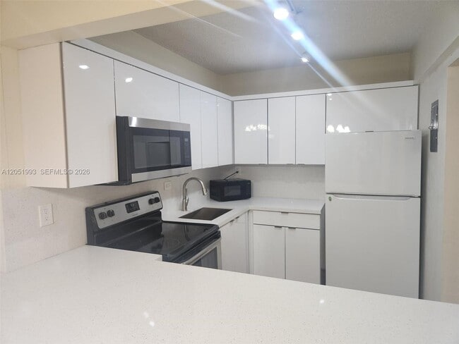 Building Photo - 8990 SW 24th St Unit 228