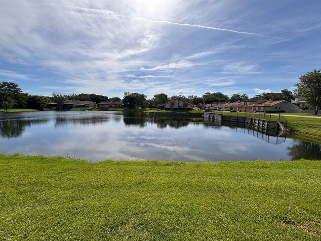 Photo - 2 Bed 2 Bath Luxury Waterfront Townhome with Screened Lanai & Garage!