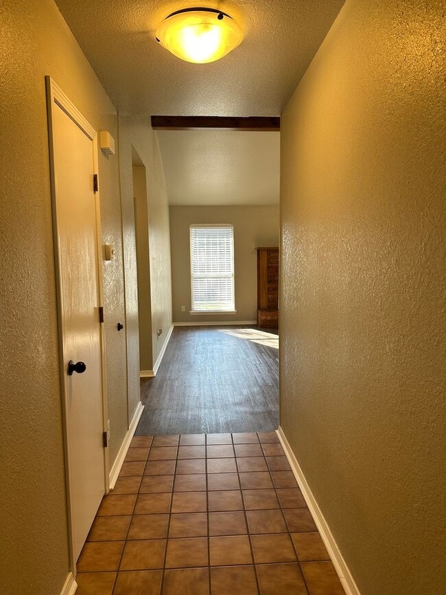 Photo - Clean, updated home on a corner lot with privacy fence and storage shed.