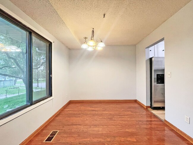 Photo - Spacious End-Unit Townhome with Fireplace, Family Room, 2-car Garage, Community Pool & Playground...