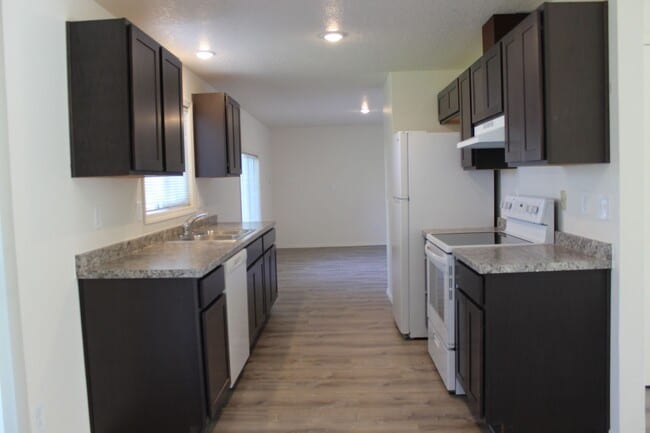 Photo - 4 BR, 2 1/2 BA home with fenced yard.