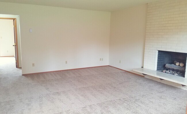 Family room with fireplace - The Colony Senior Living