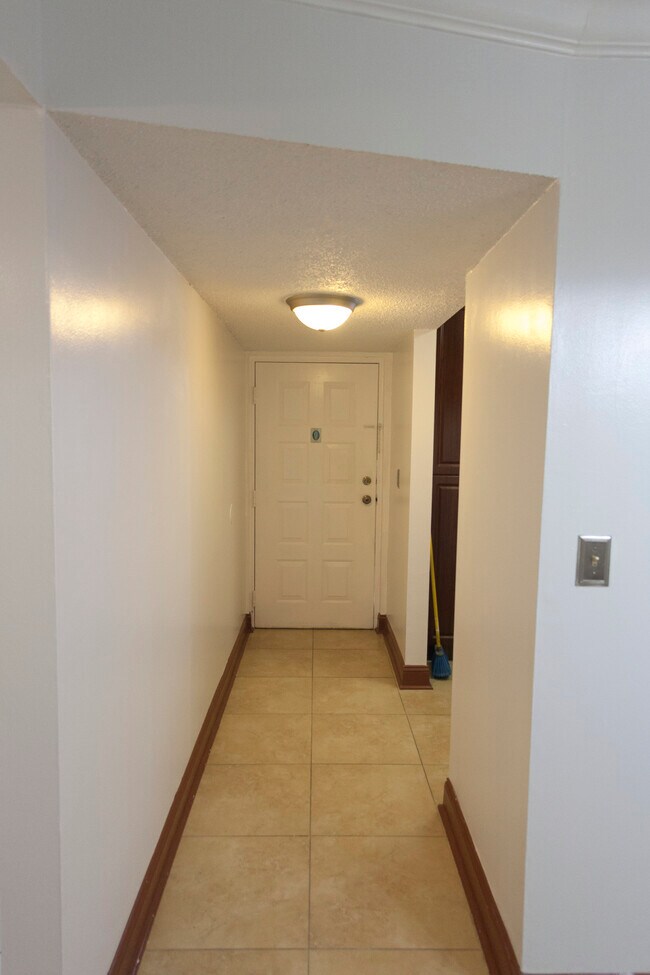 Hallway Coming From Front Door - 6081 W 24th Ave Unit 110