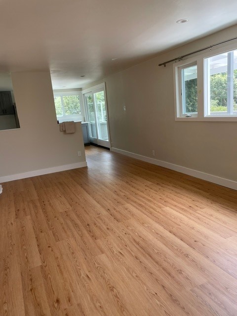 Living room looking toward the kitchen and sliding door to the extra large deck. - 101 Granlee Rd Unit 101  upper