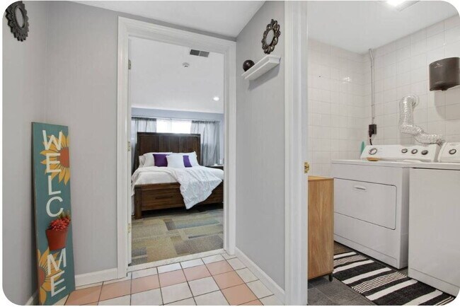 Photo - Furnished 1-Bedroom Apartment with Private Entrance and Free Laundry Unit 2