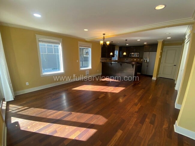 Photo - Spacious townhome with private backyard, garage parking, multiple decks, and a dedicated home off...