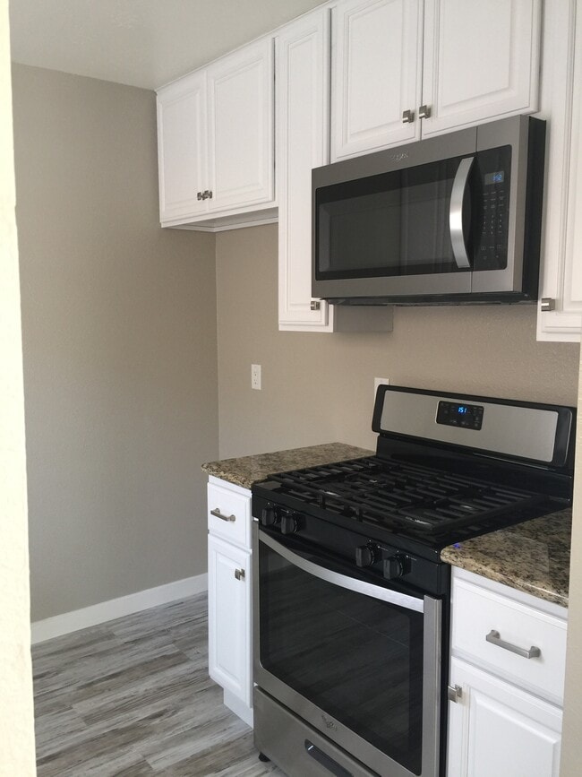 Kitchen with Appliances - 10678 Walnut St Unit 10678
