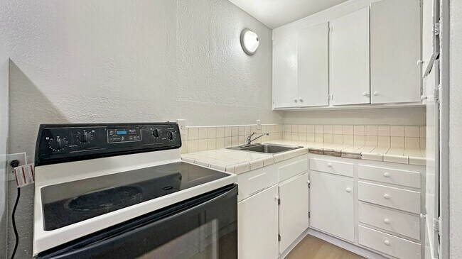 Photo - Cozy 1-bdrm, 1-bath in gated complex, includes 1 parking space, Located steps from schools and Hi... Unit 8