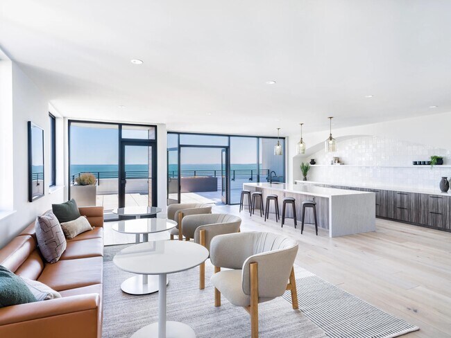A bright, open gathering space with ocean views and room to host, unwind, or connect.