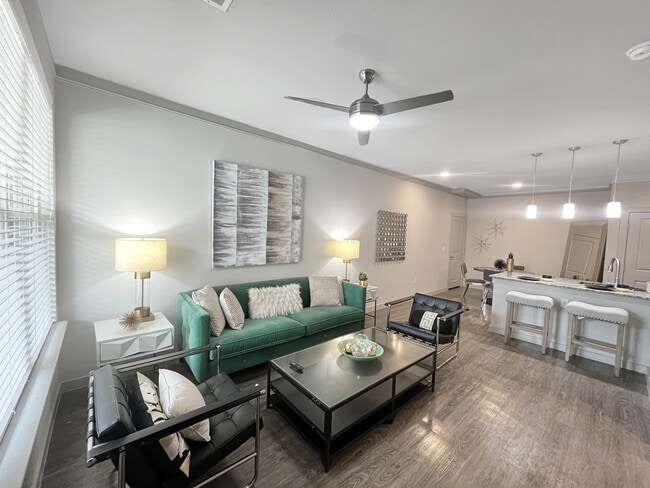 Experience the elegance of this open-concept living and dining area, designed for style and comfort.