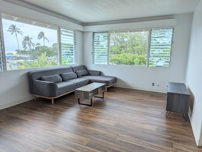 Living room showing new flooring and furniture - 44-511 Kaneohe Bay Dr Apartments Unit Upstairs