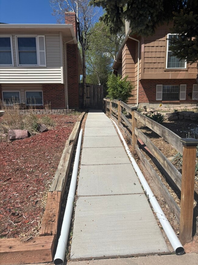 Private walking path and entrance - 5170 Saddle Dr Unit Studio by UCCS