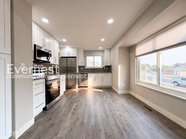 Photo - 3 Bed, 2 Bath Home with Fenced Yard & Garage / Available Now!