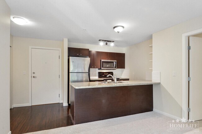 Photo - Introducing a charming 2 bed, 2 bath condo with a spacious patio fit for entertaining - Located ... Unit 209