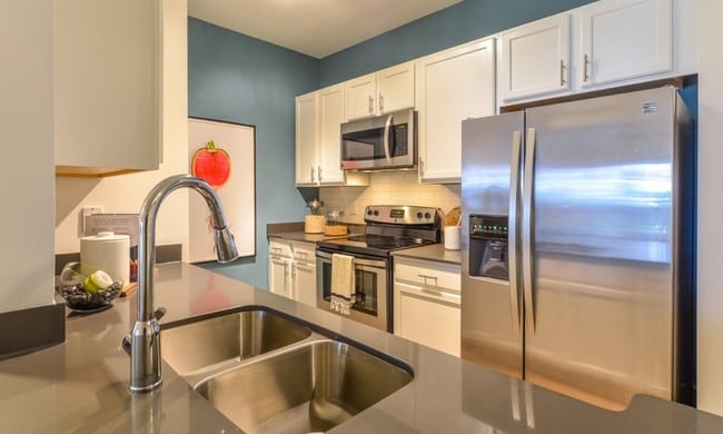 Modern Kitchen with Stainless-Steel Appliances - The Kendrick Apartments