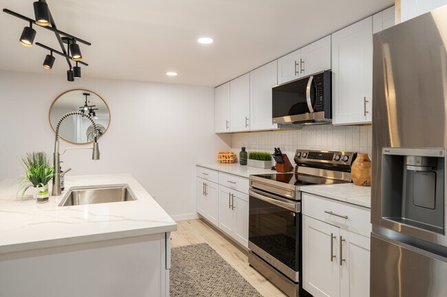 Kitchen w/ Quartz Counters - 1215 Columbine St Unit B
