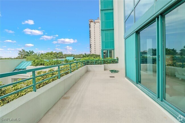 Building Photo - 7515 Pelican Bay Blvd Unit 2A Rental