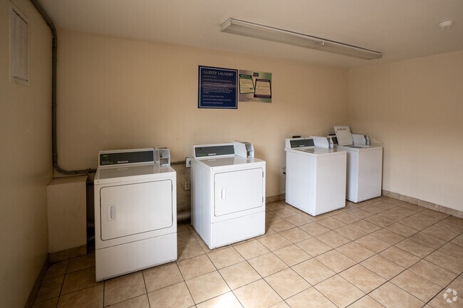 Laundry room - The Inn and Suite Apartments