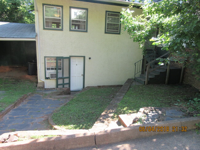 Side Entry shows Apt C up top - 100 Harmon St Apartments