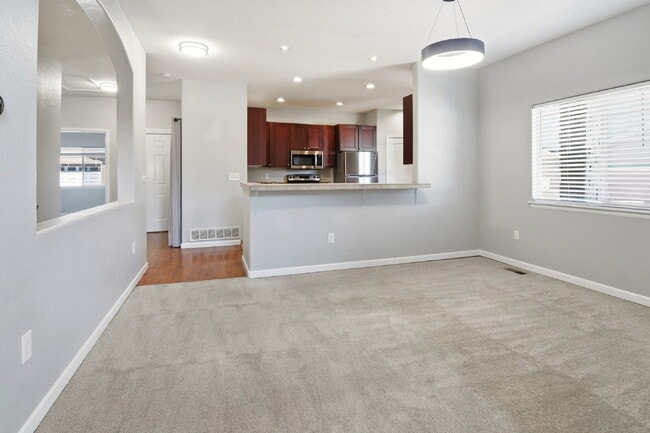 Photo - $2,940.45 - 4 Bed, 3 Bath Townhome In Commerce City with Central AC and In Unit Laundry! Unit #21C