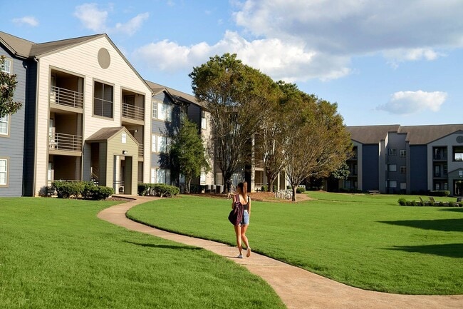 Enjoy scenic green spaces and modern living just steps from campus at The Preserve at Tuscaloosa. - The Preserve at Tuscaloosa