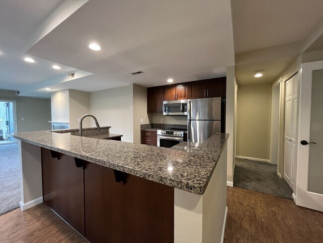 Photo - Ground Floor End Unit on Jantzen Beach with River Views & Flexible Living Space