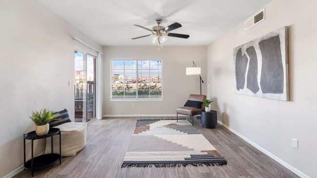 Pleasure in refined wood-style floors, sliding doors leading to your private patio, large windows, and a ceiling fan gracing our spacious living rooms.