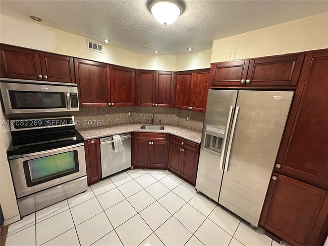 Building Photo - 3360 Spanish Moss Terrace Unit 203