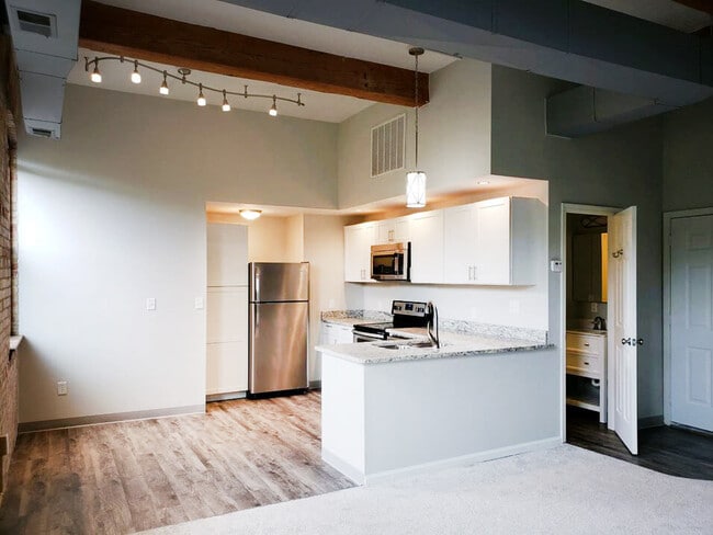 Hardwood-Style Flooring and Unique Lighting Fixtures