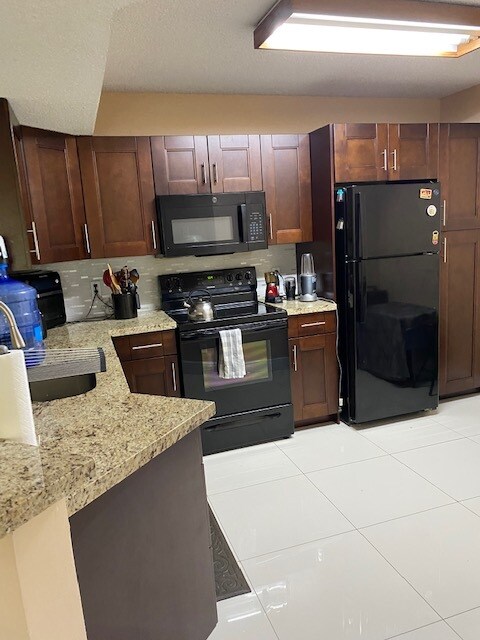 Photo - 8891 Wiles Rd Condo Unit 203