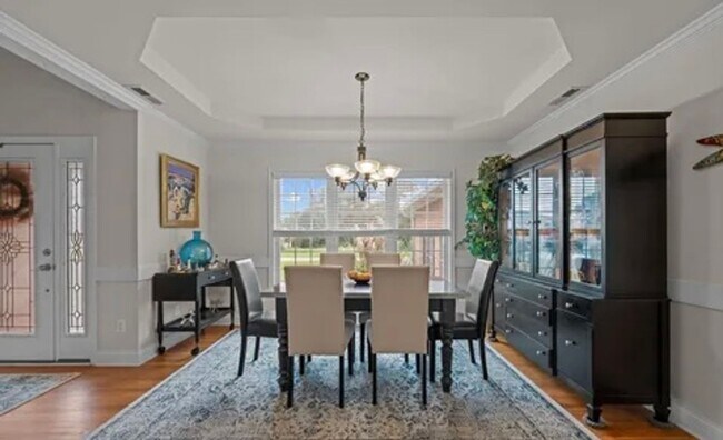 Photo - **Stately Brick Home in Fairfield Harbour | Tray Ceiling, Column, Bonus Room & Screened Porch**
