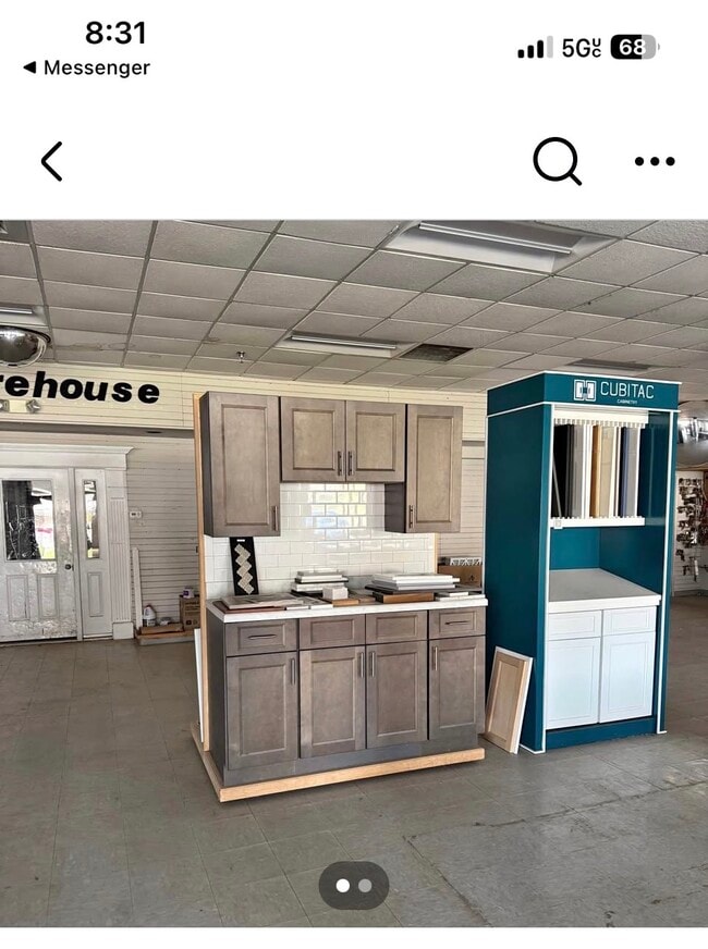 The grey kitchen cabinets are now installed