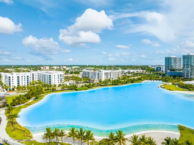 Wake up to waterfront views and a vibrant community designed around outdoor living. - SoLe Mia Rentals
