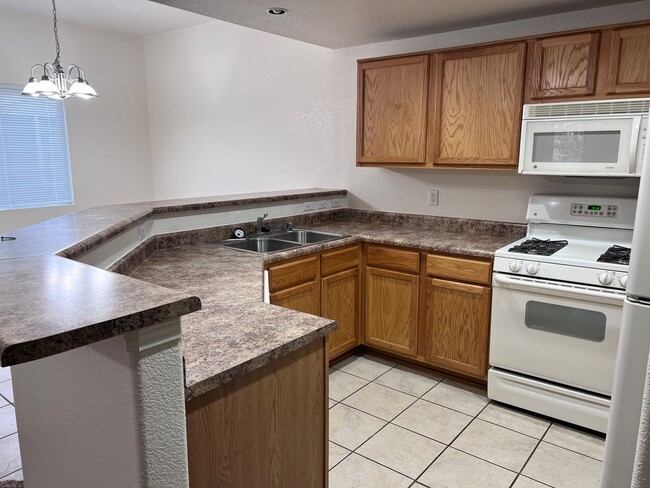 Photo - Wonderful 3 Br condo in gated community with the major appliances and 1 car garage.