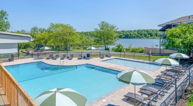 Welcome to Lakeshore Preserve, where luxury meets tranquility. Dive into our stunning pool with breathtaking waterfront views and unwind in a serene atmosphere. Your perfect retreat awaits. Schedule a tour today and embrace waterfront living! - Lakeshore Preserve