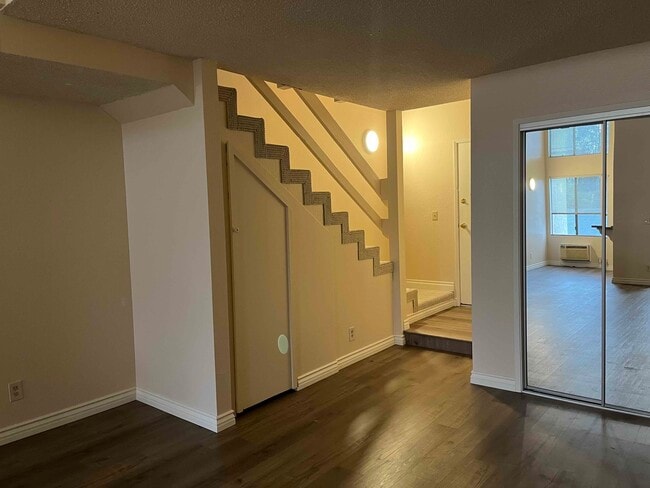 stairs to loft and closets downstairs - 616 Veteran Ave Unit 206