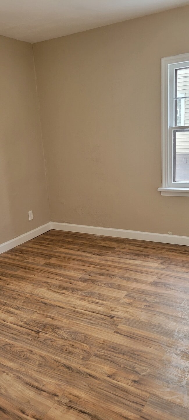 Photo - Two story house with full basement and garage.