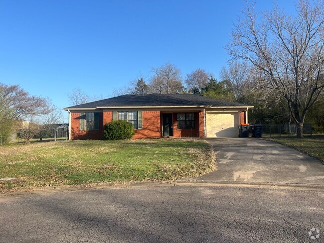 Building Photo - This cozy house features a fenced backyard...