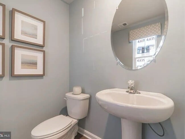 Powder room on main level - 377 Aylesbury Ln