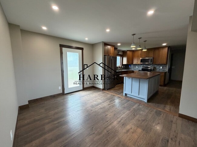 Photo - *1/2 Off First Months Rent* Spacious 3BR Home with 2-Stall Garage & Private Deck in Kasson