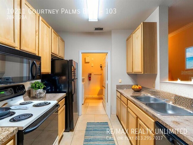 Photo - 10211 Courtney Palms Blvd Unit 103