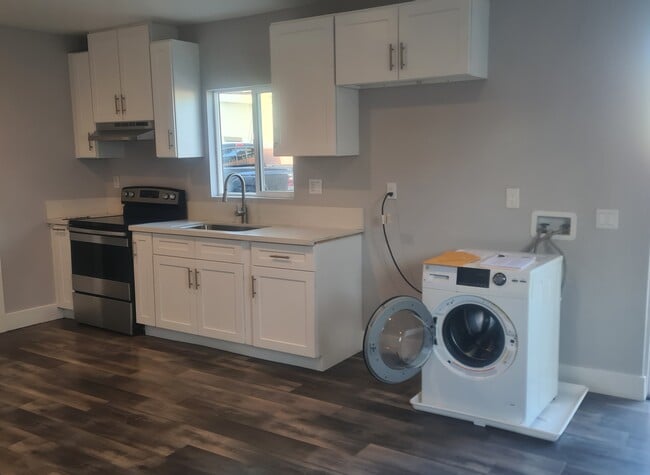 Kitchen with in unit washer dryer combo - 13108 Mercer St Unit 13108