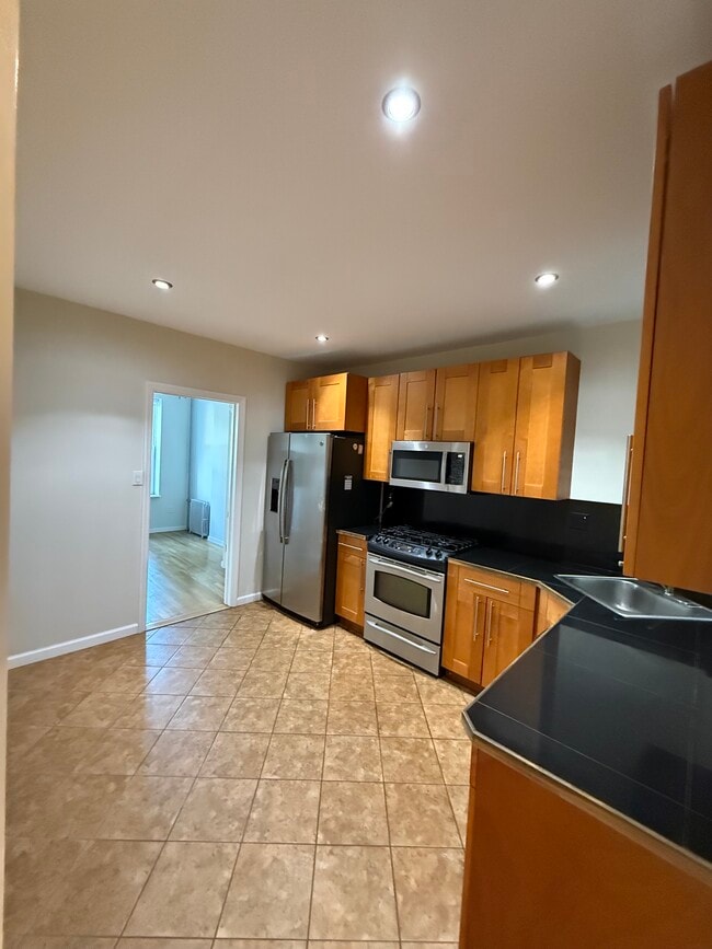 Building Photo - 7246 66th St Unit 1