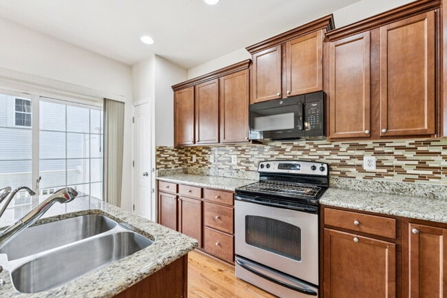 Photo - Charming town home located in a quiet, tree-lined community Field stone!